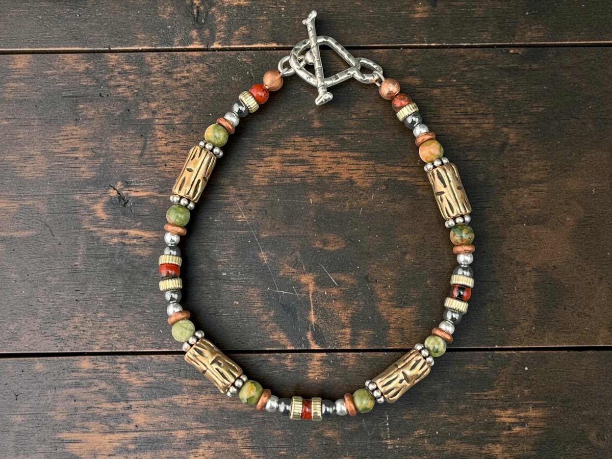Tiki beaded bracelet on barnwood