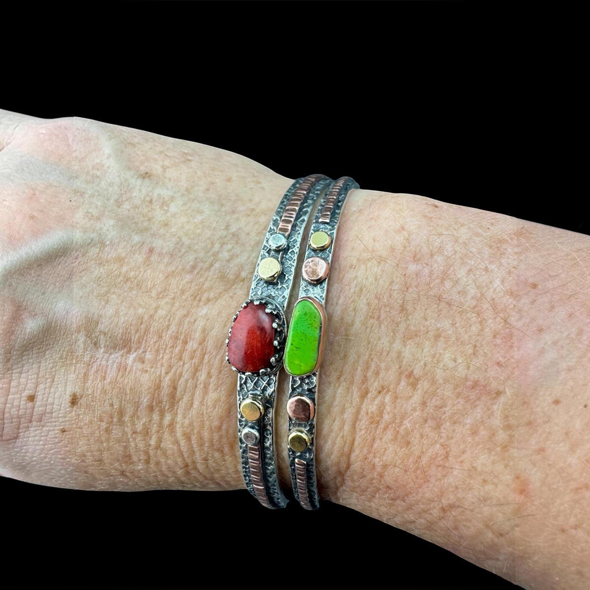 Red coral cuff stacked with the Gaspeite skinny cuff on the wrist