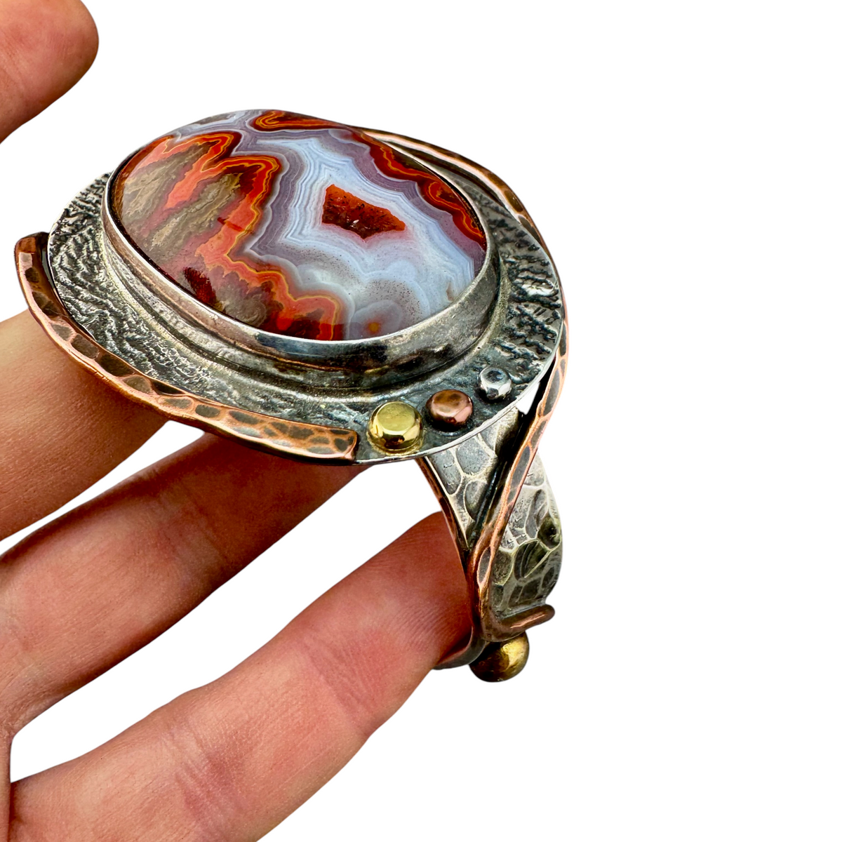 Moroccan Seam Agate cuff bracelet held in hand