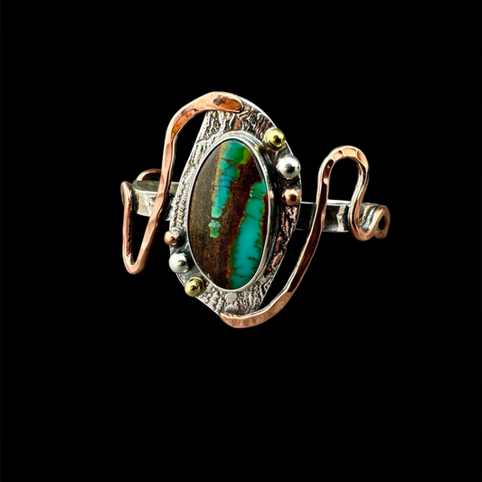Opalized wood cuff bracelet in sterling silver with hammered copper swirls