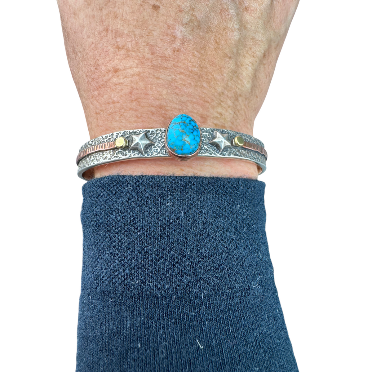 Royston Turquoise star cuff bracelet worn on the wrist