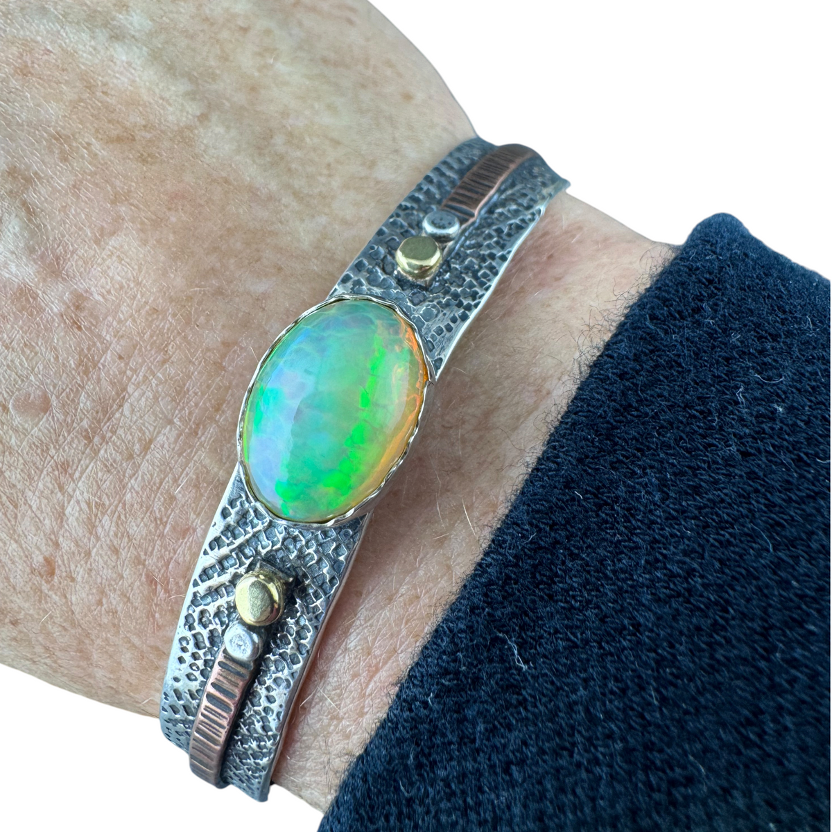 Ethiopian Opal cuff bracelet worn on the wrist