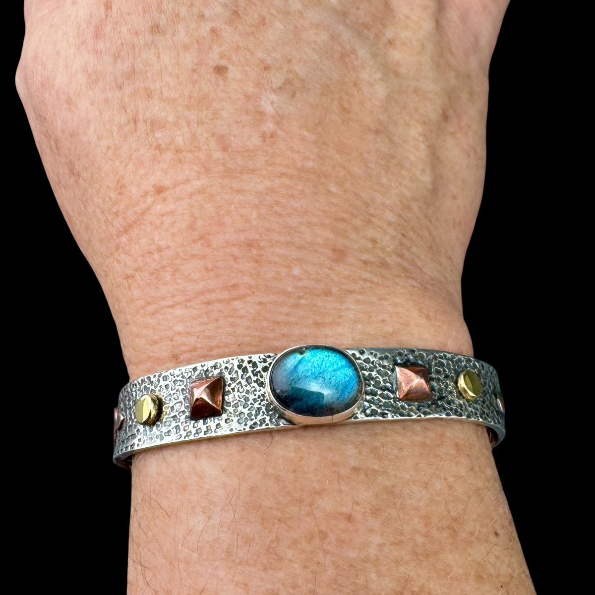 Aurora Labradorite cuff bracelet worn on the wrist