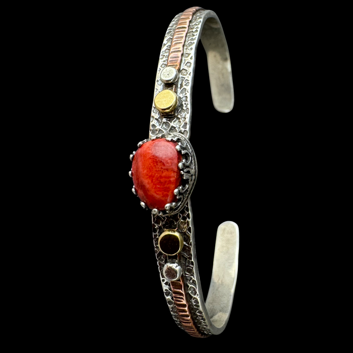 Red coral cuff bracelet in sterling silver with 18K gold and copper accents