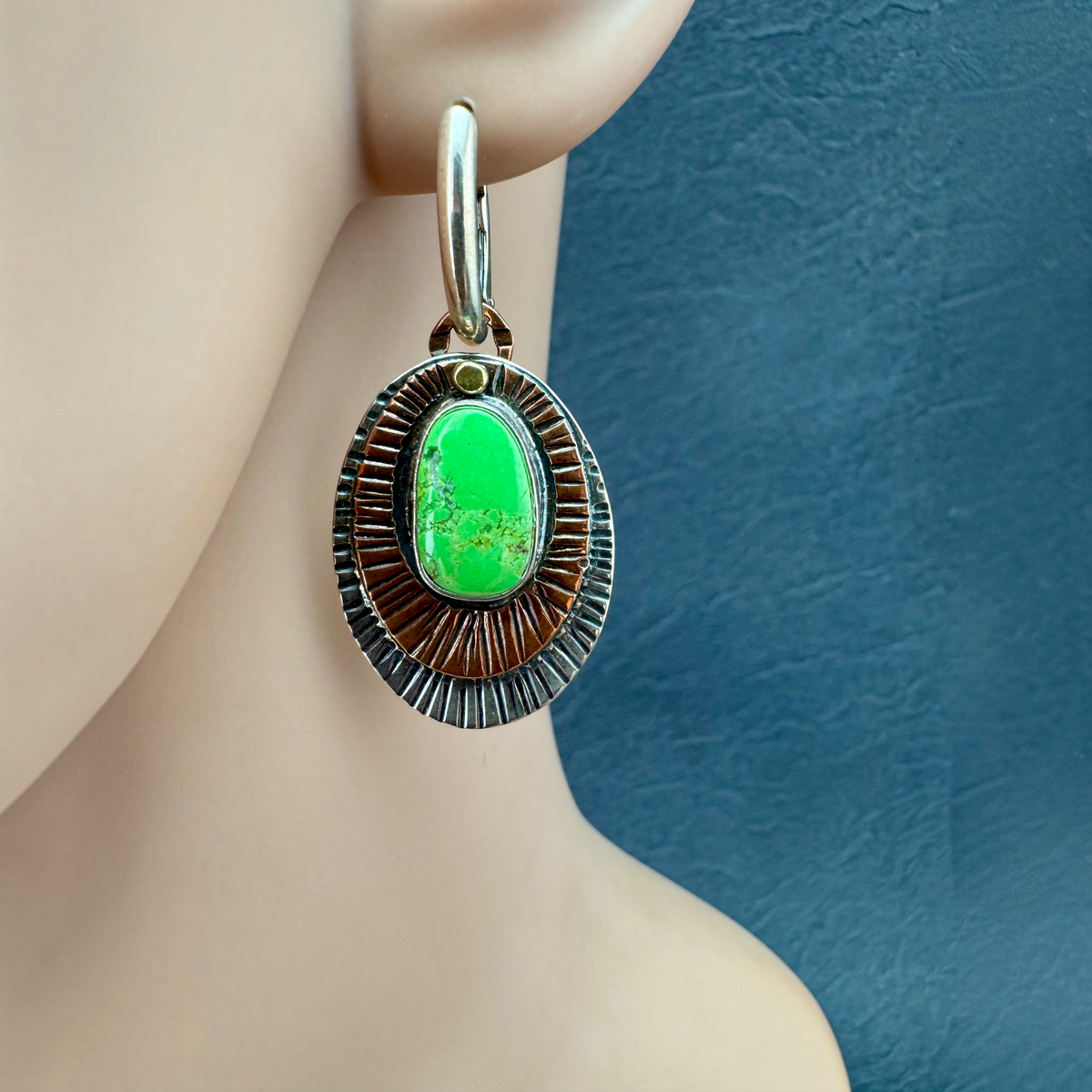 Gaspeite Mandala Oval Earrings shown on the ear, layered stamped copper and sterling silver ovals
