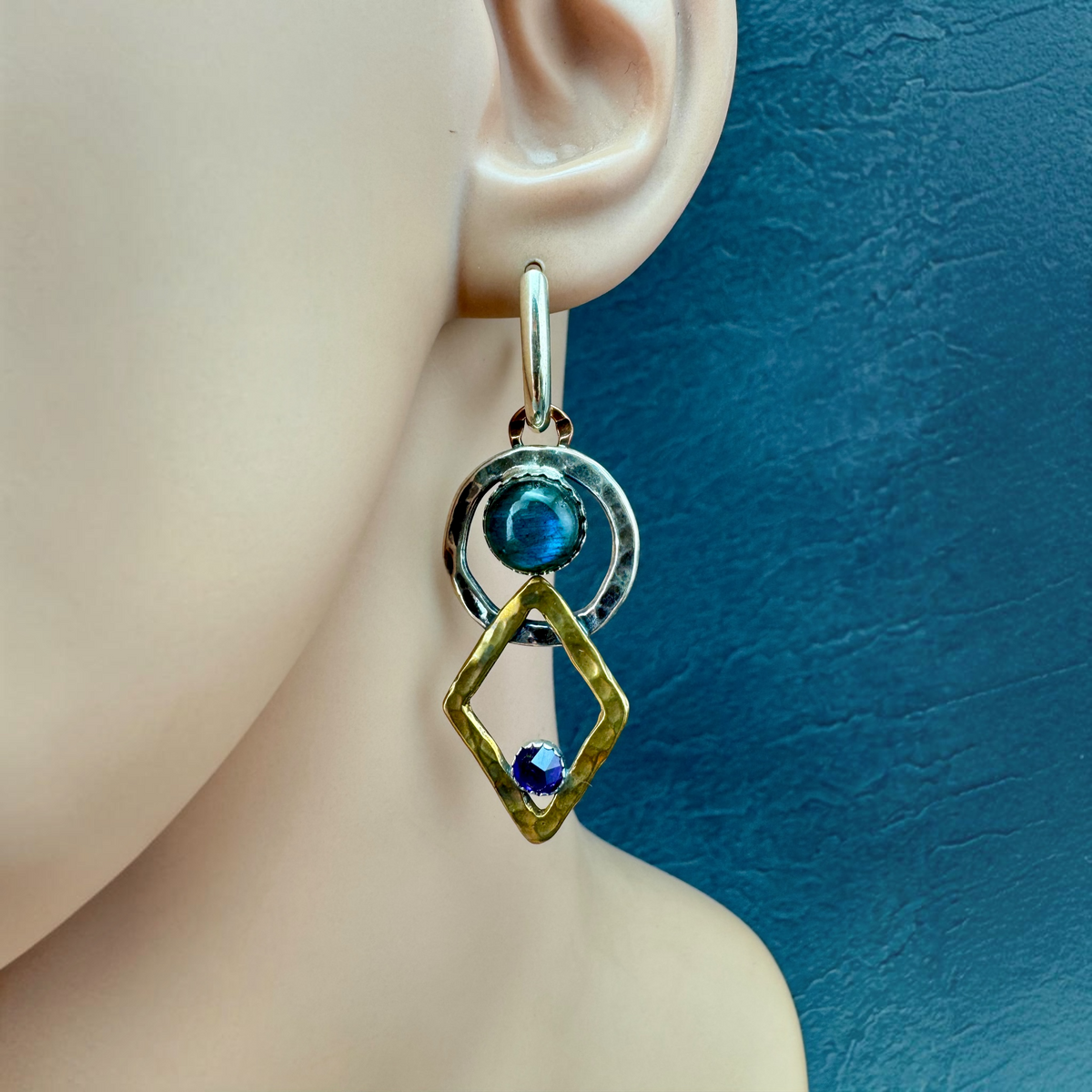 Labradorite and Amethyst Drop Earrings shown on the ear, hammered silver circle and bronze diamond