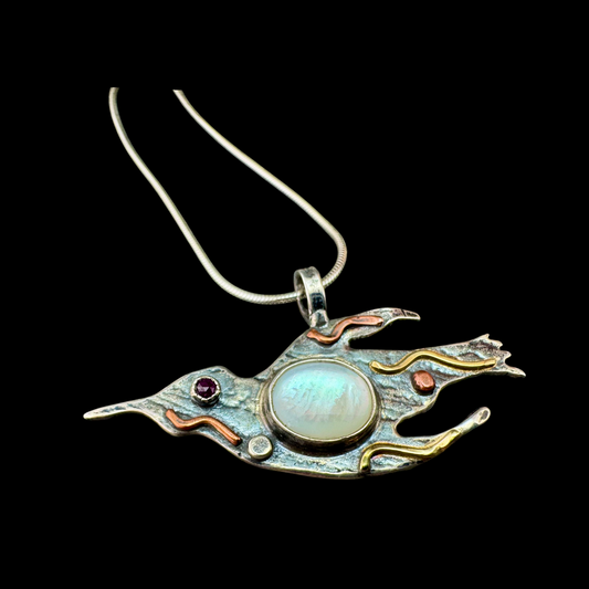 Mother of Pearl Swallow Pendant in textured sterling silver with garnet eye and gold feathering on a snake chain