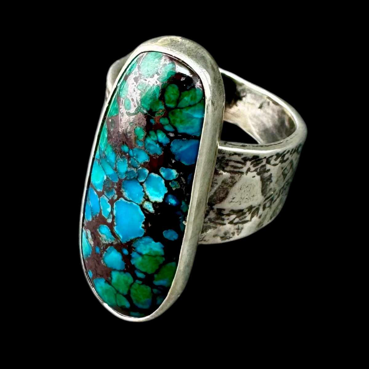 Azurite oval ring in sterling silver on a wide textured band