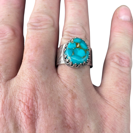 Kingman Turquoise crown ring worn on the hand
